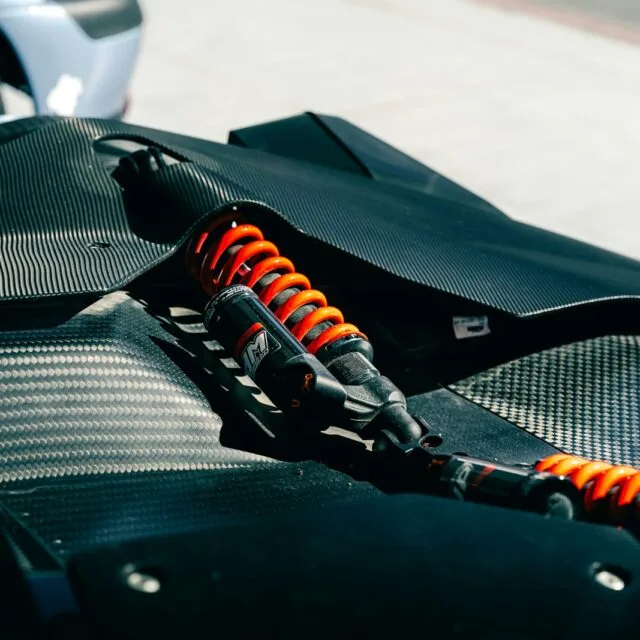 Shock absorbers are visible on this sporty vehicle.